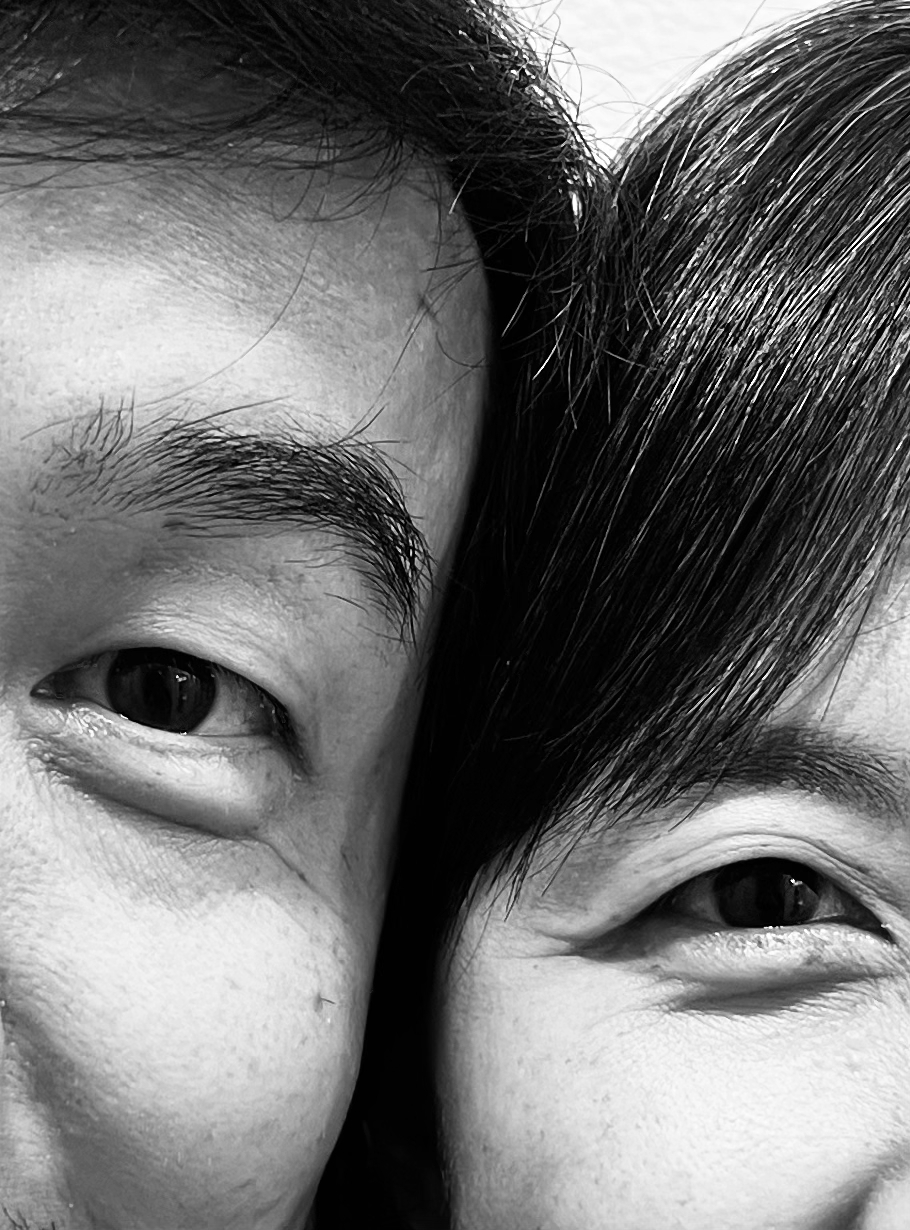 Couple's Resemblance — black and white close-up of two faces side by side.