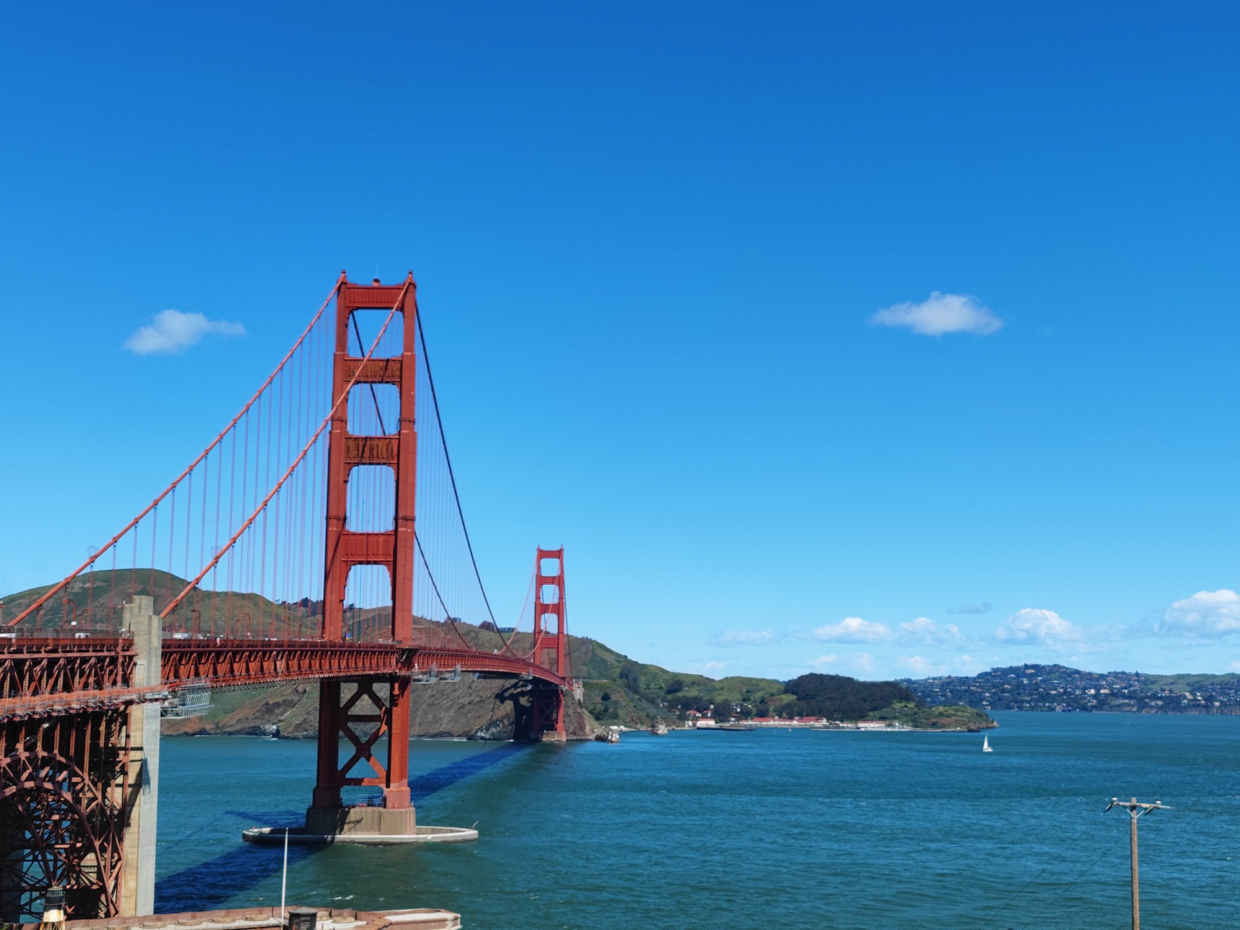 Golden Gate Bridge under a clear blue sky.